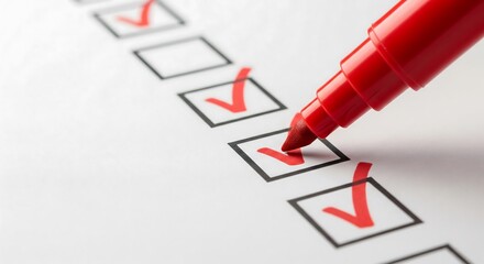 Red marker checking boxes on a checklist.