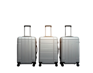 Wide PNG banner showing a row of modern suitcases in front of a glowing digital airpo 922506