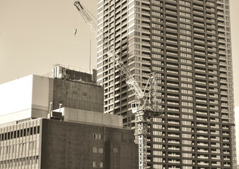 A Construction Crane Working on a New Skyscraper in a Modern City