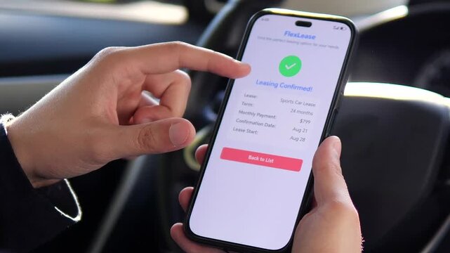 A driver's hands finalize a car leasing agreement through a mobile application, receiving immediate confirmation and terms of the approved lease. This significant financial moment is perfect for