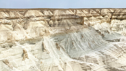 White unique rocky formations in the Bozzhira tract. A desolate, barren landscape in Kazakhstan, Mangystau. Tourism, adventure and travel