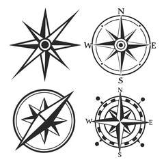 Four compass rose and navigation icons direction north