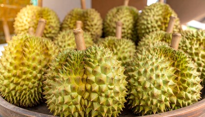 Close-up of many durians in a bowl