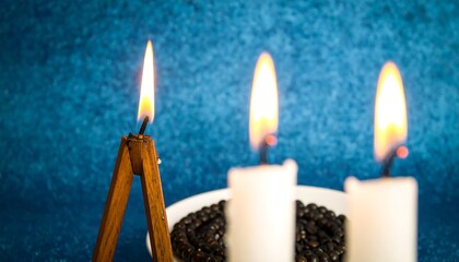 Three candles with black beads