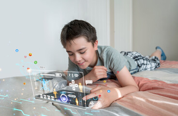 Kid boy lying on bed playing tablet with futuristic gaming UI overlay, Concept of online gaming,...