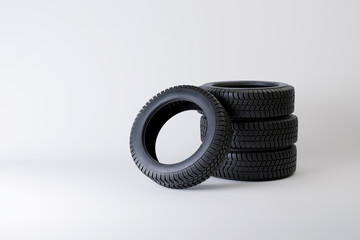 Four new tires on a white background. Season replacement of tires on winter tread.