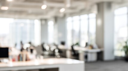 Obraz premium Blurred office interior with desks computers and people working in a bright space.