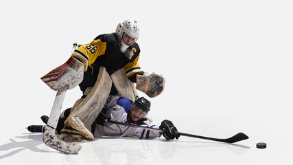 Hockey goalkeeper in yellow jersey standing over fallen rival with dominance. Concept of rivalry,...