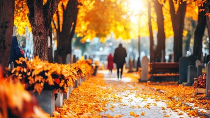 Golden Autumn Park Path with Sunlit Foliage and Distant Figure Walking Amidst Fallen Leaves