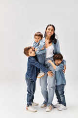 Mom enjoys quality time with her playful boys in a bright studio setting