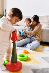 Obraz premium Engaging moments of a young mother playing with her adorable children indoors