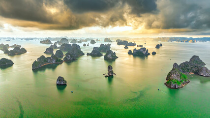 Aerial view floating fishing village and rock island, Halong Bay, Vietnam, Southeast Asia. UNESCO World Heritage Site. Junk boat cruise to Ha Long Bay. Popular landmark, famous destination of Vietnam © huythoai
