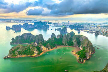 Aerial view floating fishing village and rock island, Halong Bay, Vietnam, Southeast Asia. UNESCO...