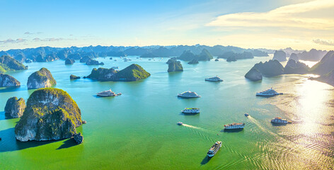 Aerial view of landscape Halong Bay, Vietnam view from adove. Tourist cruise ship floating among...