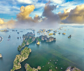Aerial view floating fishing village and rock island, Halong Bay, Vietnam, Southeast Asia. UNESCO World Heritage Site. Junk boat cruise to Ha Long Bay. Popular landmark, famous destination of Vietnam