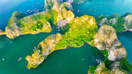 Aerial view floating fishing village and rock island, Halong Bay, Vietnam, Southeast Asia. UNESCO...
