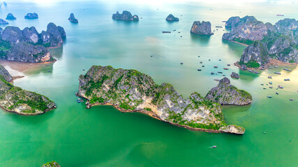 Aerial view floating fishing village and rock island, Halong Bay, Vietnam, Southeast Asia. UNESCO World Heritage Site. Junk boat cruise to Ha Long Bay. Popular landmark, famous destination of Vietnam © huythoai