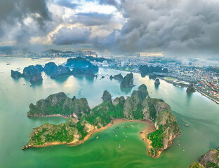 Aerial view floating fishing village and rock island, Halong Bay, Vietnam, Southeast Asia. UNESCO World Heritage Site. Junk boat cruise to Ha Long Bay. Popular landmark, famous destination of Vietnam © huythoai