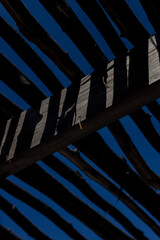 Dramatic Shadows from a Rustic Wooden Structure