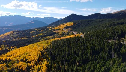 High-angle view of a mountain range with vibrant autumn foliage