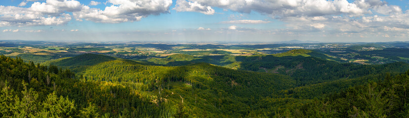 Panoramic view of the mountains and the city of Walbrzych seen from the top of the observation tower on Trojgarb Mountain near the town of Jaczków.