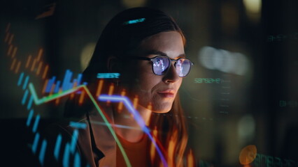 Stock market trader working hologram night closeup. Diagrams projected on face