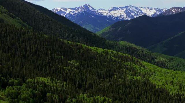 Ashcroft Mountain ghost town spring summertime morning blue sky clouds Aspen Mountain Ajax Little Annie Trailhead aerial drone Colorado scenic Rocky Mountains Elk Range Aspen Trees forward pan up