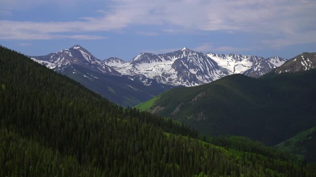 Ashcroft Mountain spring summertime morning blue sky high clouds Aspen Mountain Ajax Little Annie Trailhead aerial drone Colorado scenic Rocky Mountains Elk Range landscape static shot