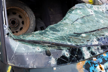 Damaged vehicle marked by gunfire in war