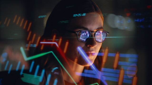 Closeup woman glasses charts. Businesswoman looking at cryptocurrency bitcoin
