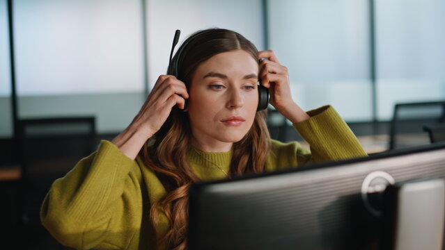 Call operator hand taking headset closeup. Online professional greeting customer