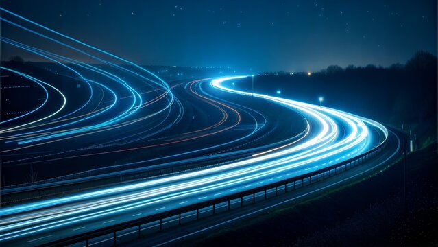 Abstract light trails on a highway at night with stars in the sky transportation concept