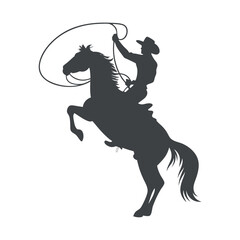 Silhouette of a Cowboy Riding a Rearing Horse with Lasso