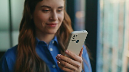 Lady hands holding phone workplace closeup. Businesswoman messaging smartphone