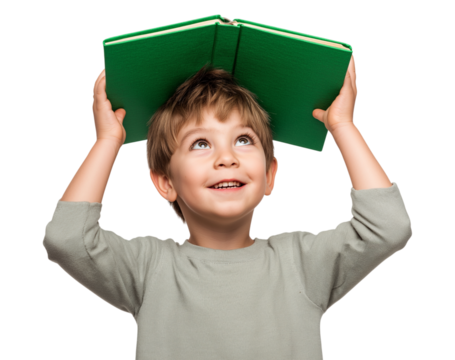 A cheerful young boy holds a vibrant green book above his head, gazing upwards with a look of wonder and happiness, symbolizing learning and curiosity isolated on a transparent background