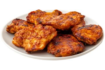 Golden grilled chicken thigh beautifully plated isolated on transparent background