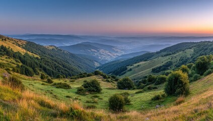 Fototapeta premium A sweeping vista of rolling hills and lush forests at sunrise, showcasing a serene mountain landscape.