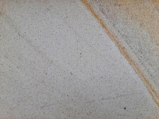 Natural sandstone texture with soft beige and brown wavy patterns, perfect for backgrounds and...