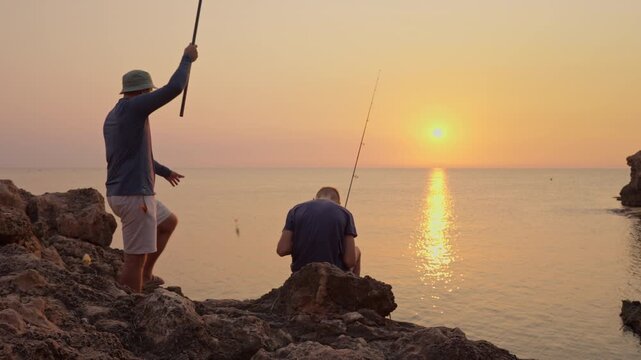 Father teaching son fishing technique, sharing peaceful moment together, generations connecting through nature