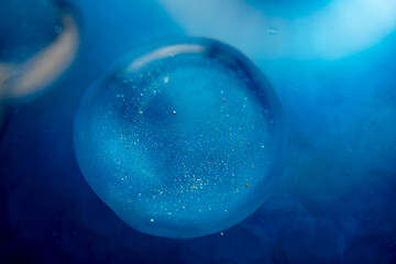 The surface of the cosmetic product has bubbles. blurred background. soft focus
