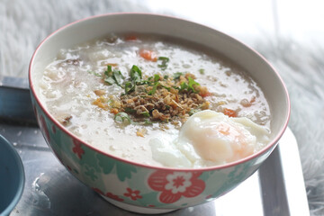 Delicious egg porridge in a ceramic cup