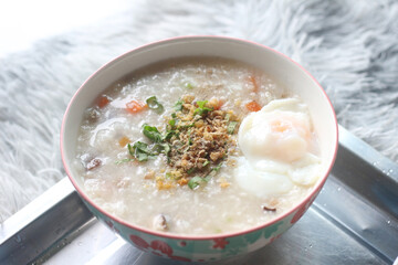 Delicious egg porridge in a ceramic cup