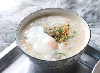 Delicious egg porridge in a ceramic cup