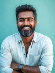 Obraz premium Smiling Man Portrait: A portrait of a confident man with a well-groomed beard and a warm, genuine smile, radiating positivity.