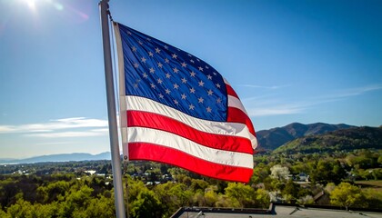 American flag waving over a valley