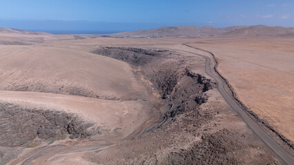 Aerial View of Desert Reservoir and Dam Structure in Arid Mountainous Landscape