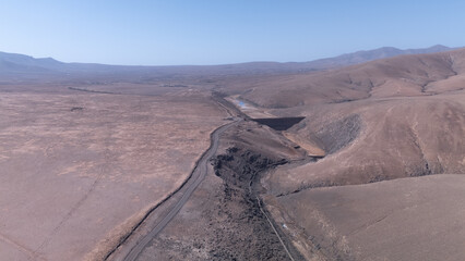 Aerial View of Desert Reservoir and Dam Structure in Arid Mountainous Landscape