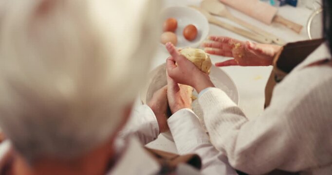 Baking, hands of grandmother and grandchild with dough in home for scones, learning and help. Family, senior woman and girl with pastry from above for cookies recipe, culinary skills and development