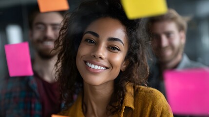 A diverse team collaborates with colorful sticky notes on a glass wall fostering creativity and innovation in a modern office setting