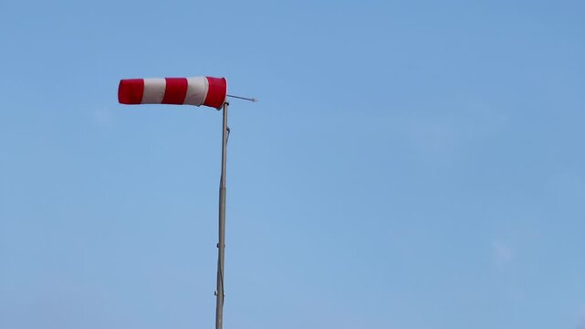 Windsock wind direction indicator blue sky aviation
